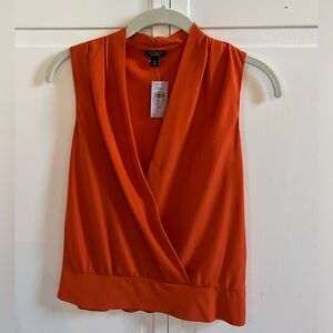 Ann Taylor orange no sleeve silk blouse. Size 2P. Never been worn, NWT